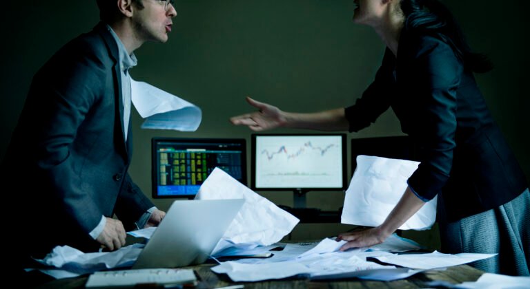 Colleagues disagreeing in a meeting